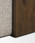 Close-up of a textured fabric surface and a wooden panel on a white background