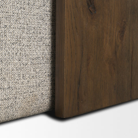 Close-up of a textured fabric surface and a wooden panel on a white background