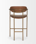 Bar stool with brown leather seats and gold metal frame on a white background