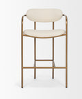Bar stool with white cushioned seat and backrest on a gold frame against a white background