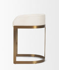 Stool with white cushioned seat and gold metal frame on a light gray background