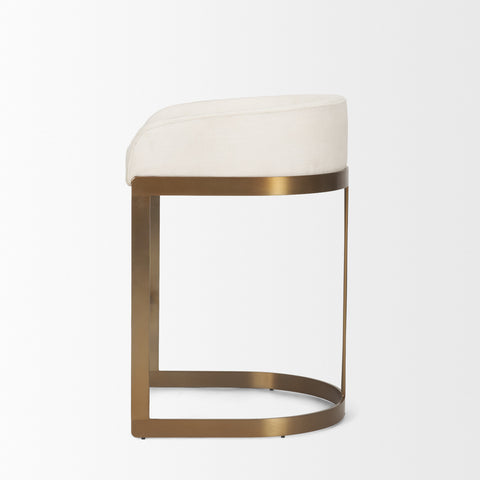 Stool with white cushioned seat and gold metal frame on a light gray background
