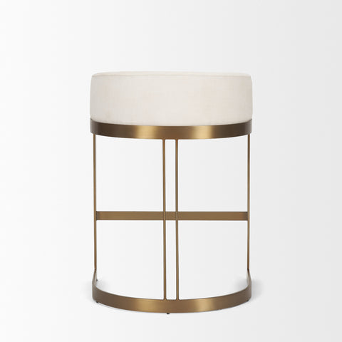 Small round table with a white cushioned top and gold metal frame on a light gray background