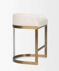 Stool with white cushioned seat and gold metal frame on a light gray background