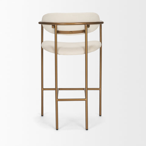 Bar stool with white cushioned seat and backrest on a gold metal frame against a white background