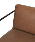 Brown leather chair with black metal frame on a white background