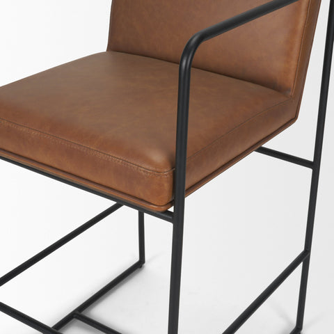Brown leather chair with black metal frame on a white background