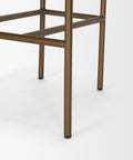 Close-up of a bronze metal chair frame on a white background