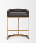 Bar stool with black cushioned seat and gold metal frame on a white background