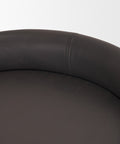 Close-up of a black leather chair on a white background