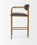 Bar stool with brown leather seat and gold metal frame on a white background
