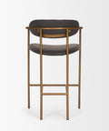 Bar stool with black cushioned seat and gold metal frame on a white background