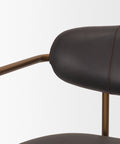 Close-up of a brown leather chair with metal armrests on a white background
