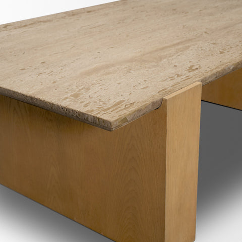 Wooden desk with a smooth surface and visible grain pattern.