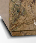 Close-up of a textured brown box with a detailed surface pattern.
