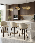 Modern kitchen with marble island, bar stools, and wooden cabinets.