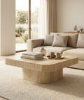 Modern living room with a beige sofa and wooden coffee table.