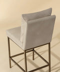 Gray bar stool with a beige background