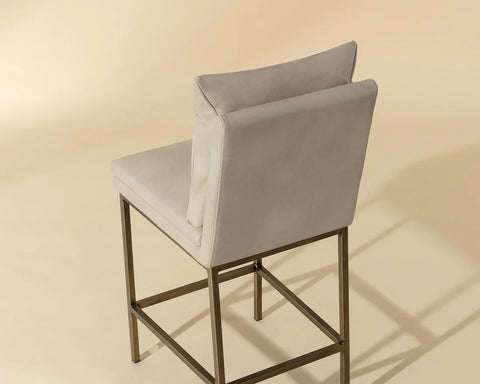 Gray bar stool with a beige background