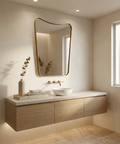 Modern bathroom with a floating wooden vanity, sink, and decorative mirror.