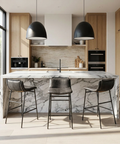 Modern kitchen with marble island and bar stools