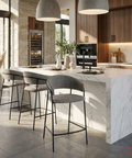 Modern kitchen with marble island and gray bar stools