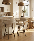 Modern kitchen with marble island and bar stools