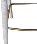 Close-up of a textured cylindrical object with a metallic frame on a white background