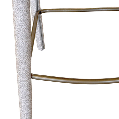 Close-up of a textured cylindrical object with a metallic frame on a white background