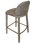 Bar stool with textured backrest and seat on a white background