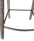 Close-up of a bar stool with textured legs on a white background