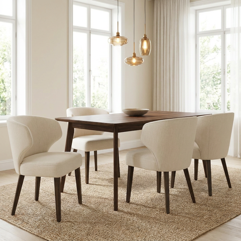 Dining room with a wooden table and beige chairs in a bright room.