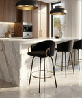 Modern kitchen with marble island and black bar stools