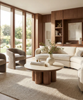 Modern living room with beige sofa, armchairs, and a wooden coffee table.