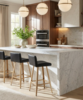 Modern kitchen with marble island and bar stools