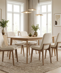 Dining room with wooden table and chairs in a bright room.