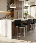 Modern kitchen with marble island and black bar stools