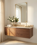 Bathroom vanity with wooden cabinet, mirror, and decorative elements.