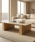Modern living room with a beige sofa and wooden coffee table.