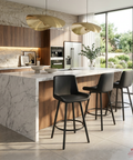 Modern kitchen with marble island and black bar stools
