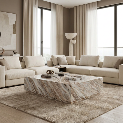 Modern living room with beige sofa, marble coffee table, and large windows.