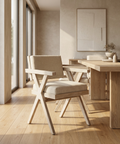Modern dining room with wooden table and chairs in a bright room.