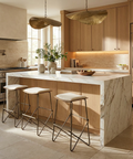 Modern kitchen with marble island and bar stools