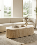 Modern living room with a beige sofa and wooden coffee table.