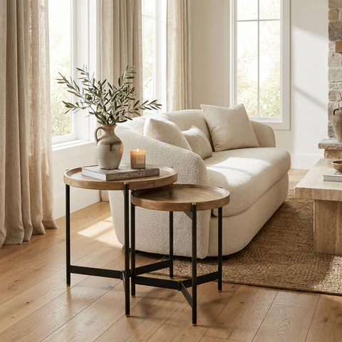Cozy living room with a beige sofa, wooden side tables, and decorative elements.