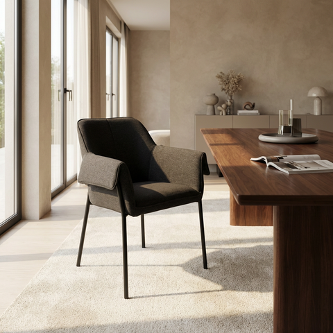Modern chair in a stylish room with a wooden table and large windows.