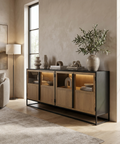 Modern living room with a wooden sideboard, lamp, and decor items.