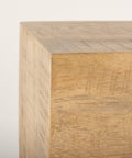 Wooden cube with a light finish on a white background