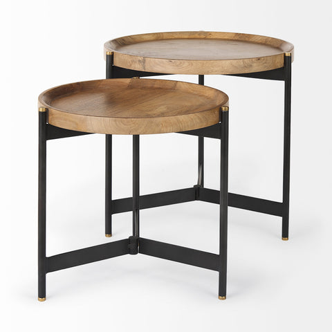 Two round wooden tables with black metal frames on a white background