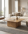 Modern living room with a wooden coffee table, beige sofa, and armchair.
